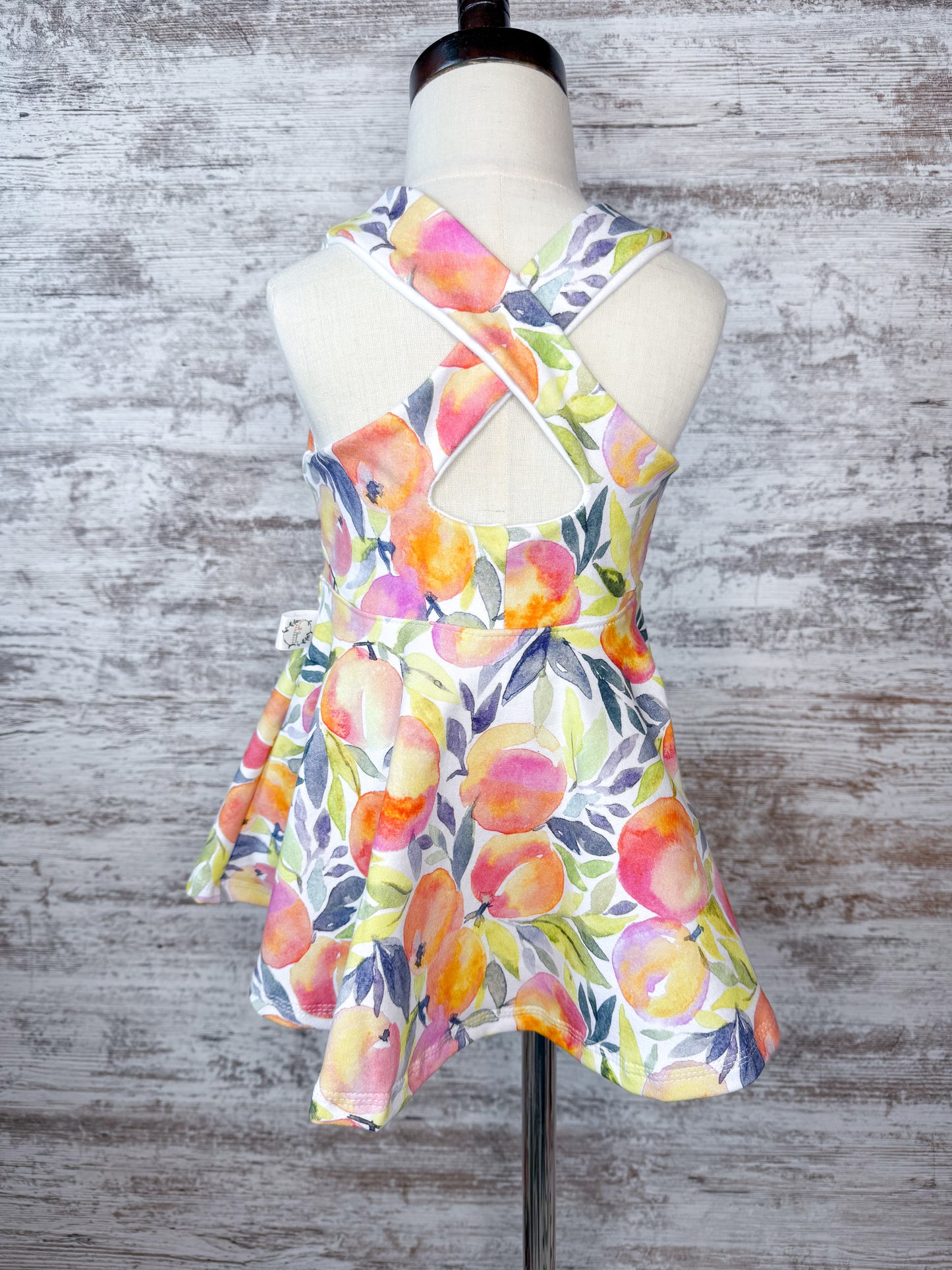 Crossback Twirl Peplum-Peaches
