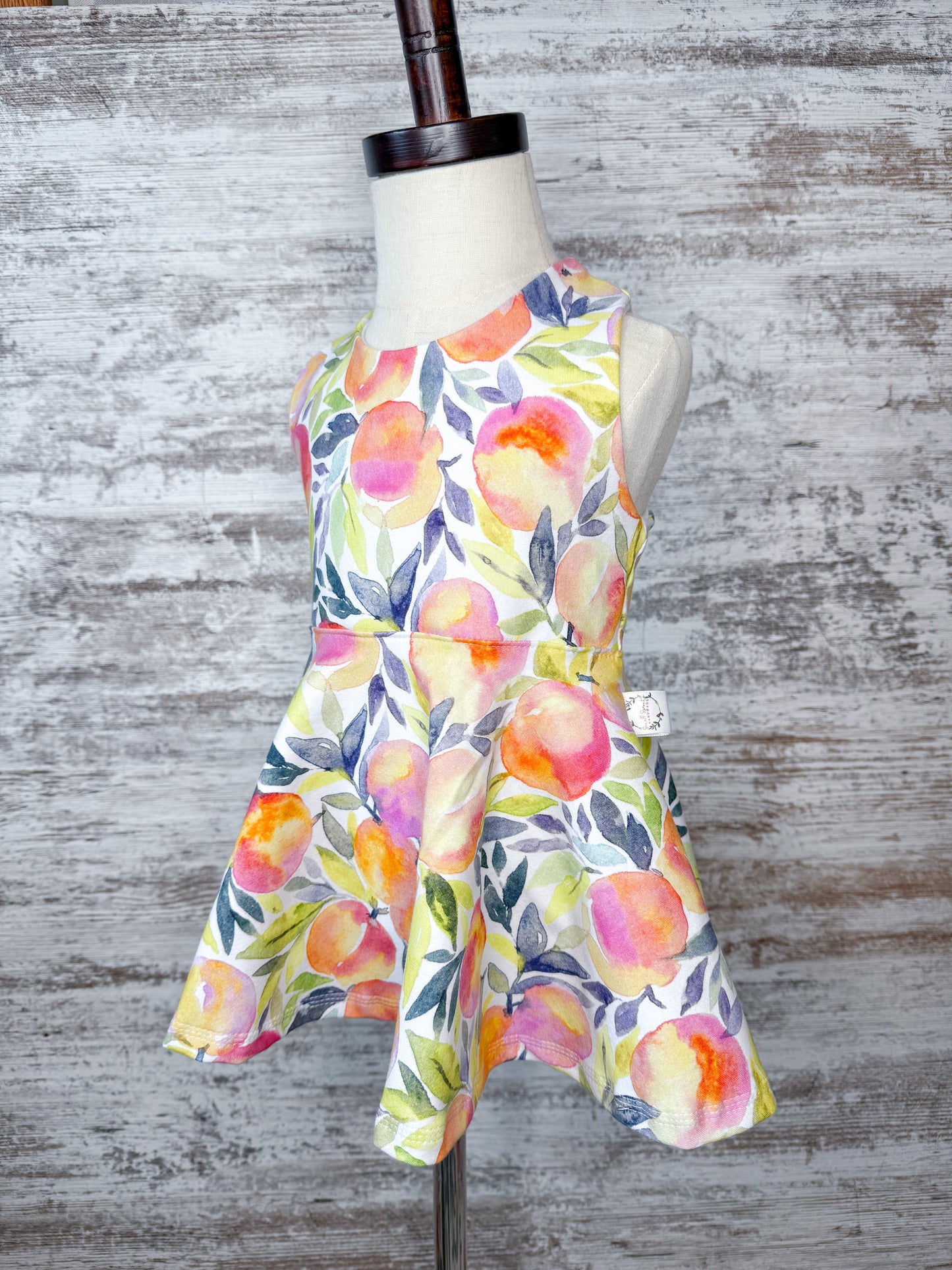 Crossback Twirl Peplum-Peaches